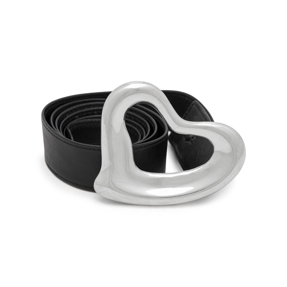 Elsa Peretti, Tiffany & Co., Open Heart Buckle & Black Leather Belt: Elsa Peretti, Tiffany & Co., Open Heart Buckle & Black Leather Belt Open Heart belt buckle in sterling silver with a black leather belt and sterling stud closure. Stamped 925 at back of buckle.