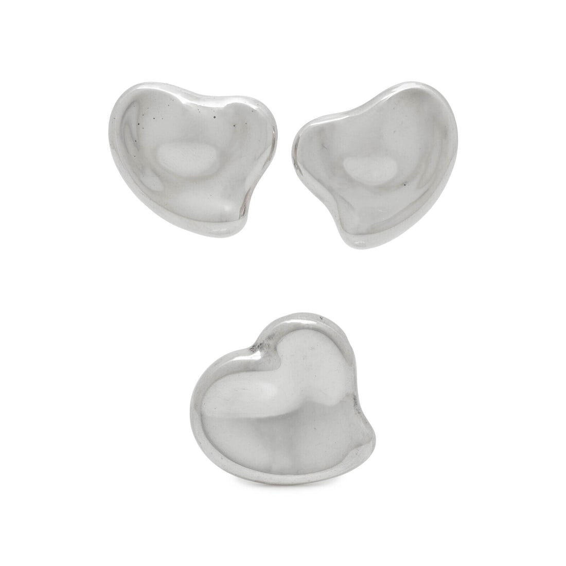 Elsa Peretti, Tiffany & Co., Full Heart Earrings and Mirror Pendant: Elsa Peretti, Tiffany & Co., Full Heart Earrings and Mirror Pendant THE FIRST Pair of Full Heart ear clips in sterling silver. Standard ear clip backs. Includes dust bag. Stamp: Elsa Peretti /