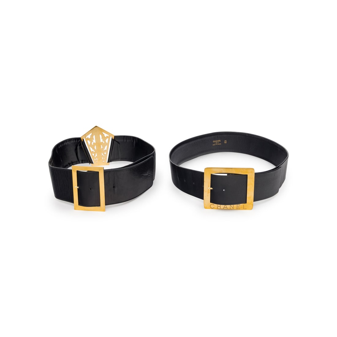 Chanel, Two Black Leather Belts: Chanel, Two Black Leather Belts THE FIRST Large belt in black leather with a gold-tone metal filigree buckle at front; buckle closure at back. Label: Chanel Size Label: Unmarked Date: 1980's Country