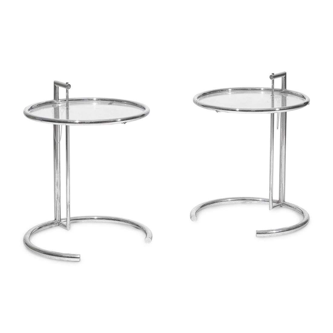 Eileen Gray (Irish, 1878-1976) Pair of end tables, model e1027: Eileen Gray (Irish, 1878-1976) Pair of end tables, model e1027 chromed steel, glass stamped to metal 'Eileen Gray' 25-45 h x 20 dia inches. This lot is located in Philadelphia.