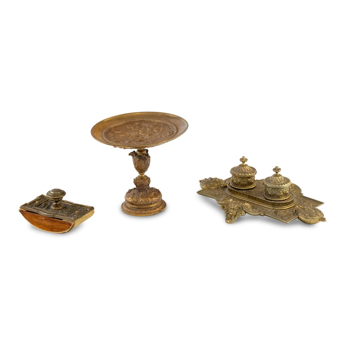 A Continental Brass Tazza, Rocker Blotter and Ink Stand: A Continental Brass Tazza, Rocker Blotter and Ink Stand Height of tazza 6 1/2 x diameter 7 inches. This lot is located in Chicago.