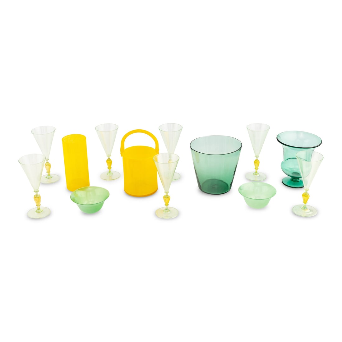 A Collection of Green and Yellow Glass Articles: A Collection of Green and Yellow Glass Articles Primarily Italian, 20th Century comprising seven Murano wine stems, two cases, two bowls and two vases. Height of tallest 10 inches. Property from the C