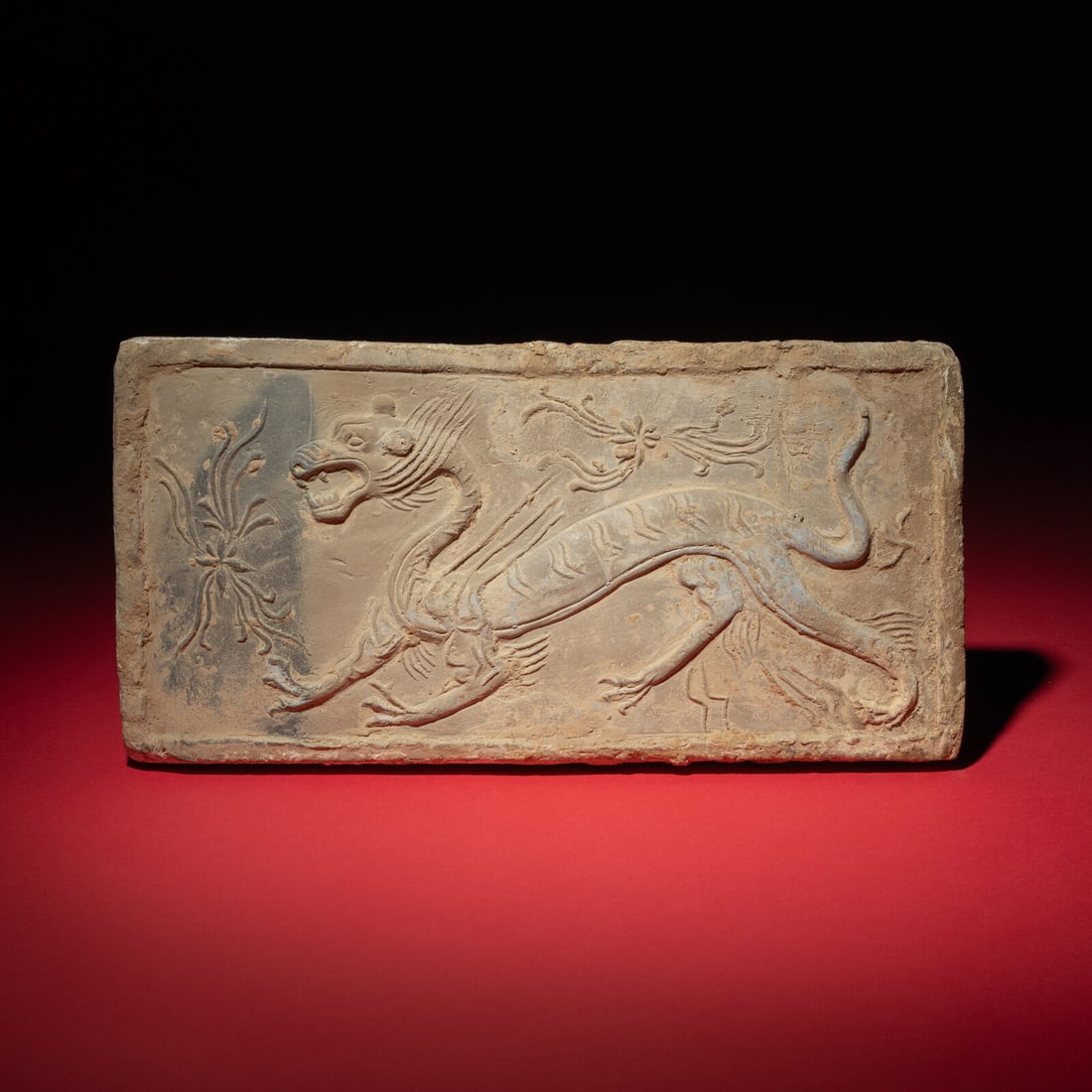 A Chinese Grey Pottery 'White Tiger' Relief Tomb Brick, Southern Dynasties: A Chinese Grey Pottery 'White Tiger' Relief Tomb Brick, Southern Dynasties 南朝 灰陶四神白虎畫像磚 Southern Dynasties (420-589) The re
