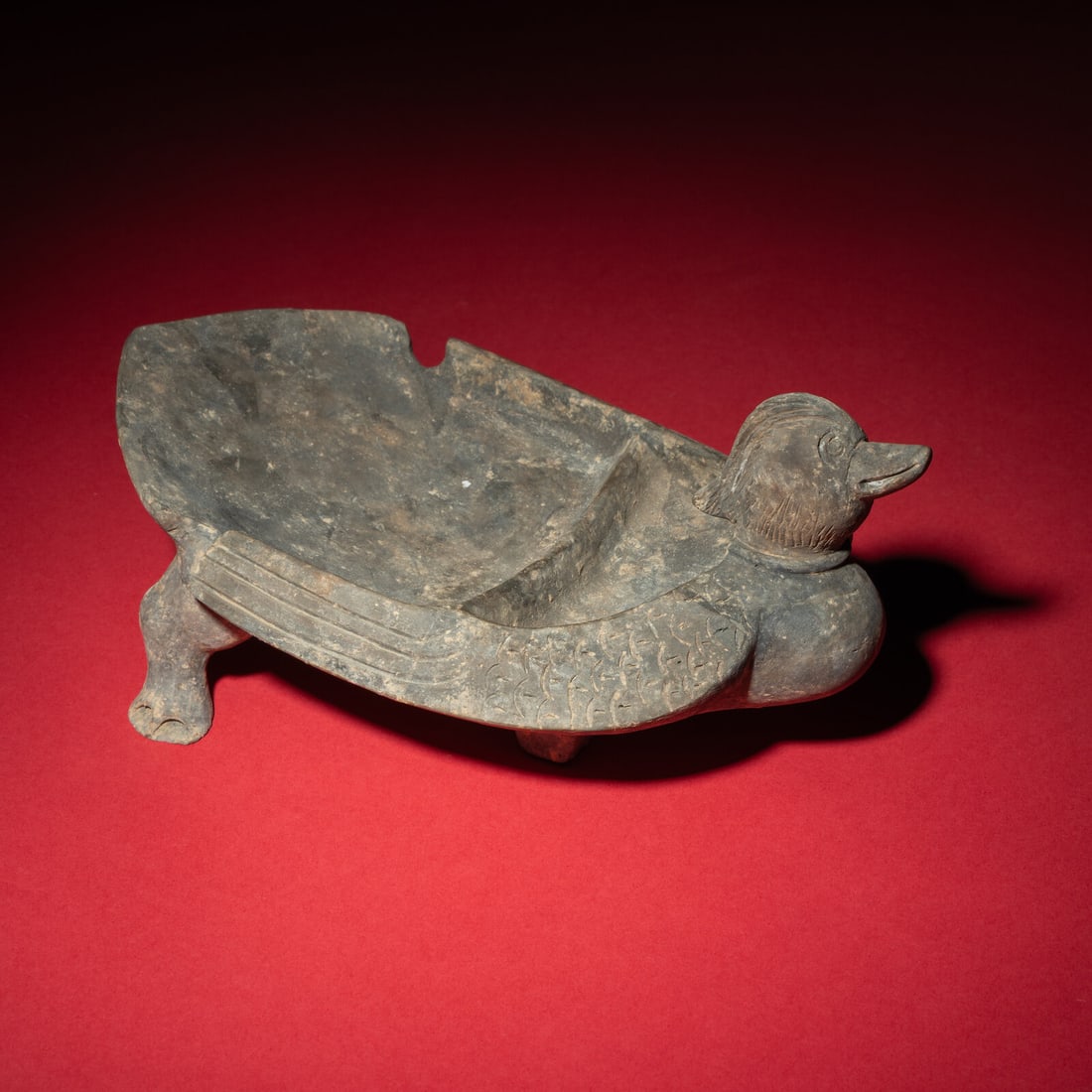 A Chinese Grey Pottery Mandarin Duck-Form Inkstone, Six Dynasties (1 of 5)