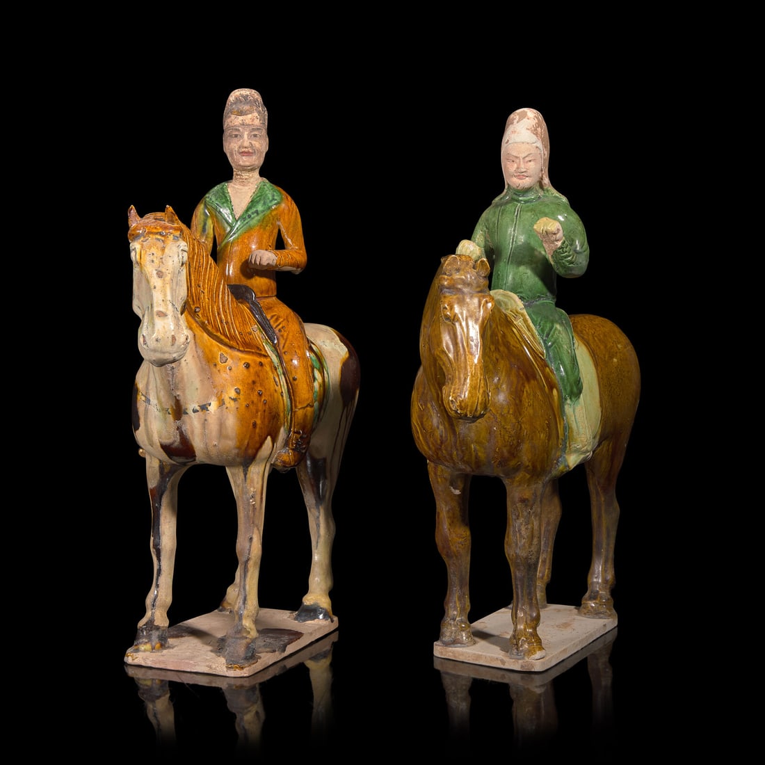 Two Chinese Sancai Glazed Pottery Equestrian Figures, Tang Dynasty: Two Chinese Sancai Glazed Pottery Equestrian Figures, Tang Dynasty 唐 三彩騎馬俑兩尊 Tang Dynasty (618-907) One horse of olive brown, the rider with a c