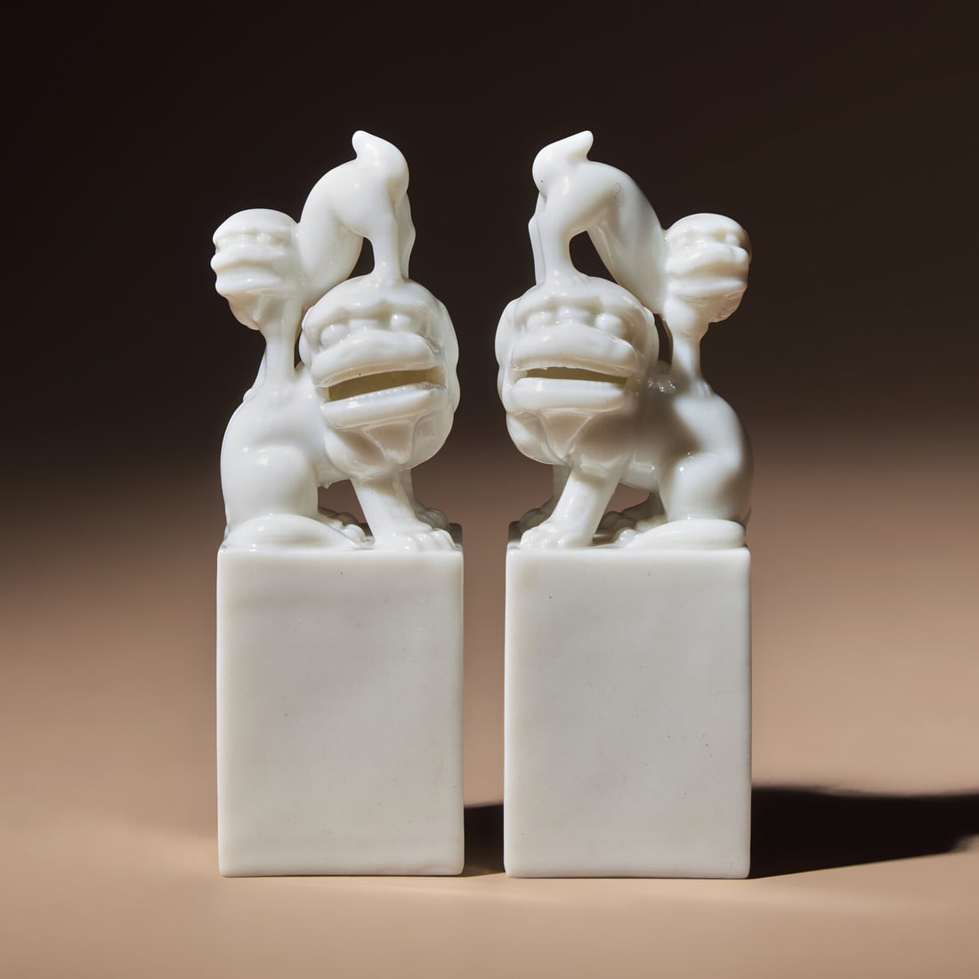 A Pair of Chinese Blanc-de-Chine Porcelain Fu Lion Seals, 18th/19th Century: A Pair of Chinese Blanc-de-Chine Porcelain Fu Lion Seals, 18th/19th Century 清中期 德化白瓷太獅少獅印章一對 18