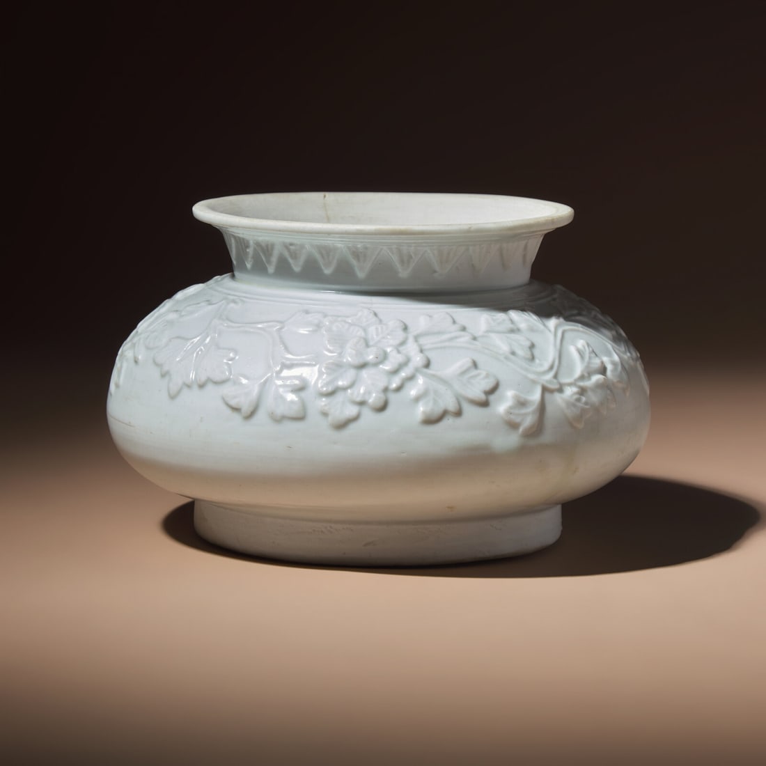A Chinese White Glazed Molded Porcelain 'Floral' Jar, Mid Ming Dynasty, 15th Century (1 of 3)