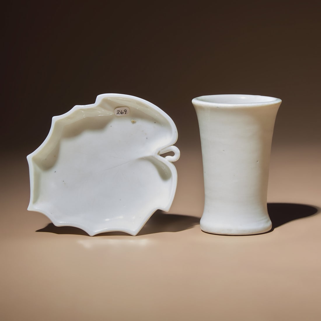 A Chinese Blanc-de-Chine Porcelain Brush Pot, Bitong, and a Leaf-Form Washer, 17th-18th Century: A Chinese Blanc-de-Chine Porcelain Brush Pot, Bitong, and a Leaf-Form Washer, 17th-18th Century 明末清初 德化白瓷筆筒及葉形