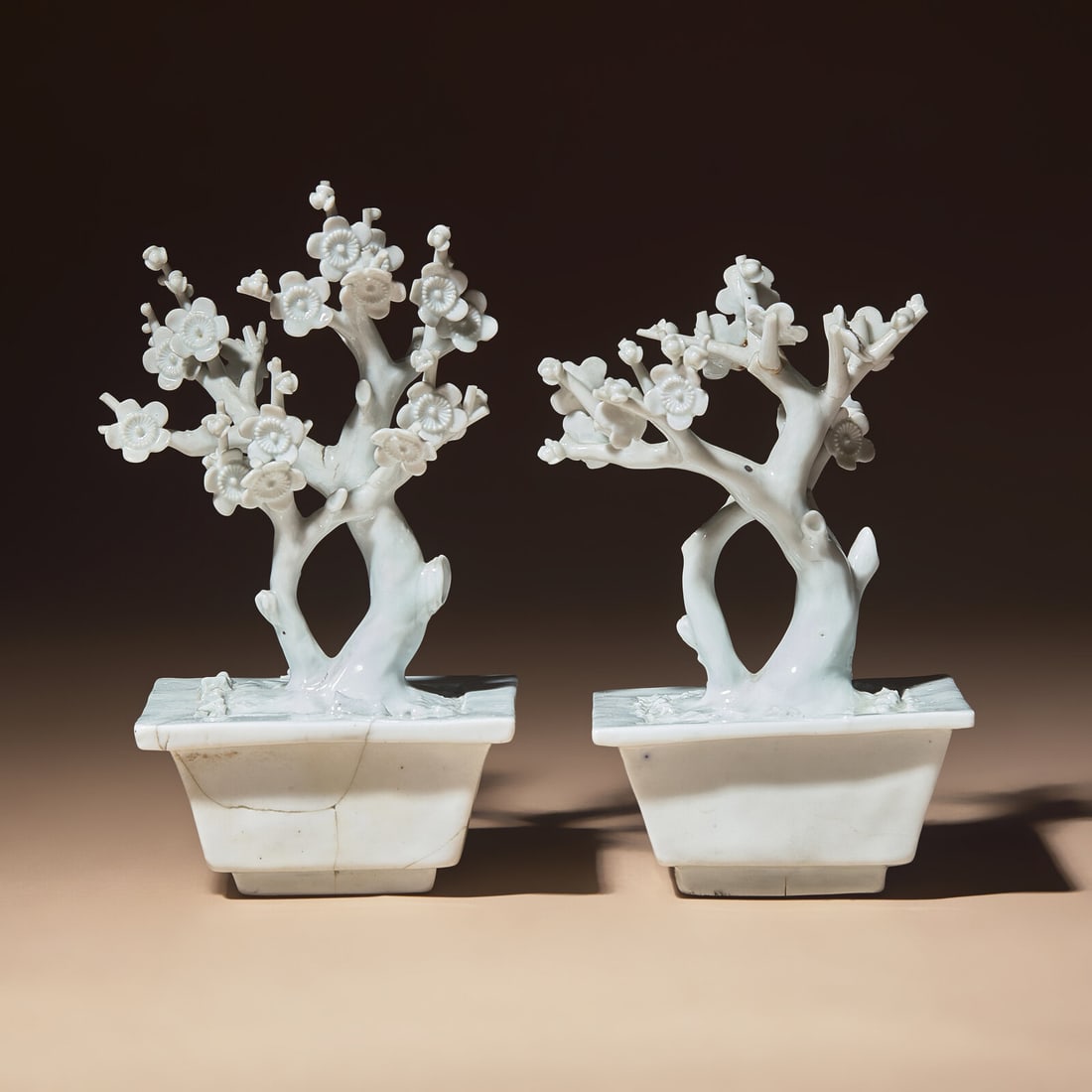 A Pair of Chinese Blanc-de-Chine Porcelain Potted Trees, 18th-19th Century: A Pair of Chinese Blanc-de-Chine Porcelain Potted Trees, 18th-19th Century 清中期 德化白瓷塑梅花盆景一對 18th-19th C