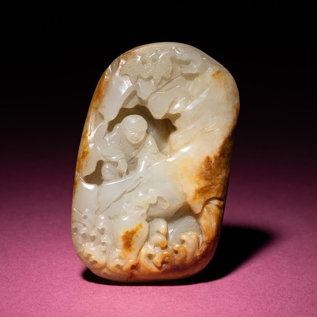 A Small and Finely Carved Chinese Russet and Pale Celadon Jade Mountain, 18th/19th Century: A Small and Finely Carved Chinese Russet and Pale Celadon Jade Mountain, 18th/19th Century 清中期 青白玉留皮人物圖把件 18t