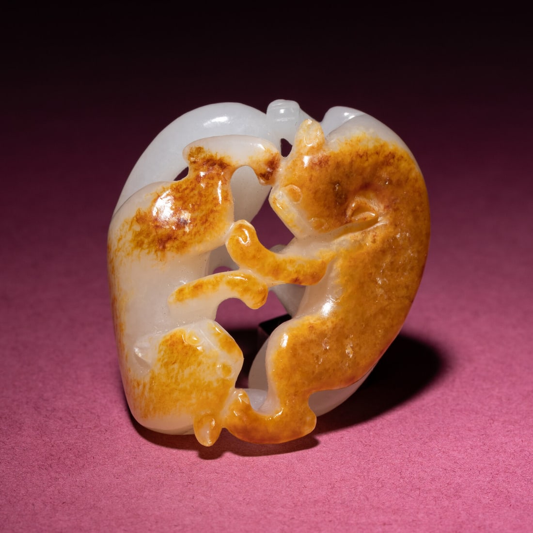 A Chinese Russet and Jade 'Double Badger' Pendant, 18th/19th Century: A Chinese Russet and Jade 'Double Badger' Pendant, 18th/19th Century 清中期 白玉帶皮如意雙歡佩 18th/19th Century The pendant pie