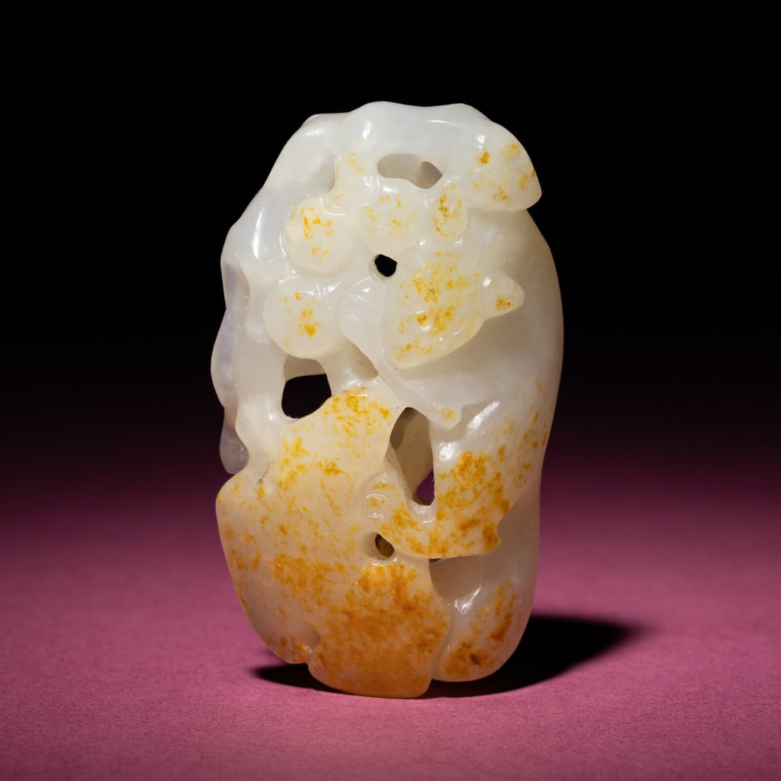 A Chinese Russet and White Jade 'Squirrel and Grape' Carving, 18th/19th Century (1 of 5)