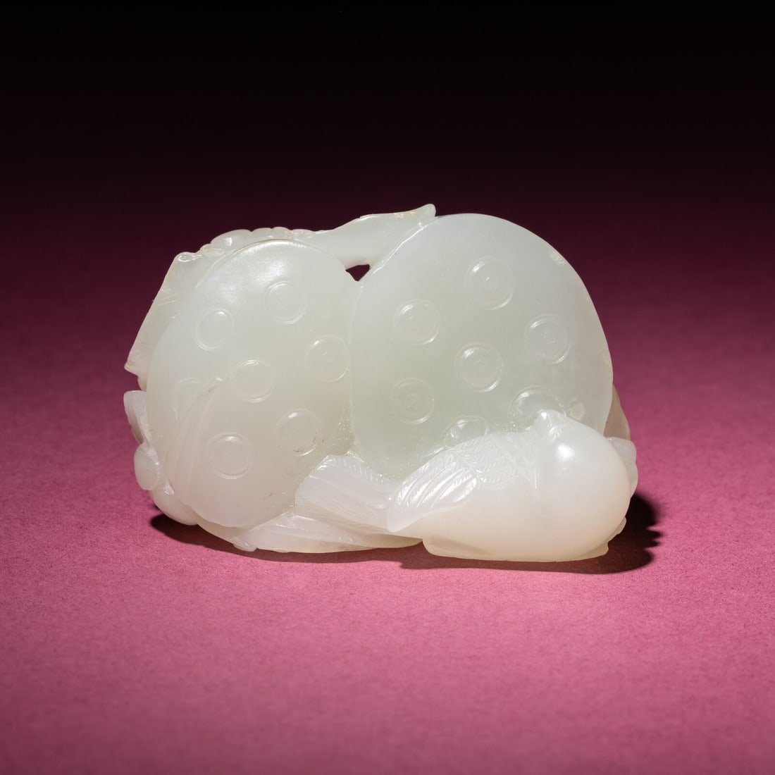 A Chinese White Jade Carving of Double Lotus Pods, 18th/19th Century: A Chinese White Jade Carving of Double Lotus Pods, 18th/19th Century 清中期 白玉雙蓮子把件 18th/19th Century Carved to depict a sparrow rest