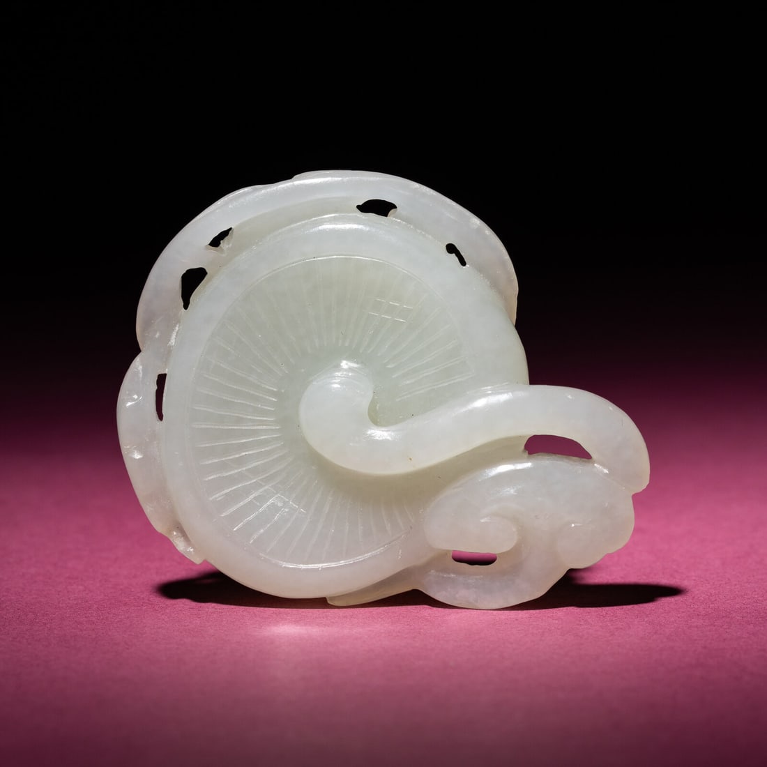 A Chinese Pale Celadon Jade 'Lingzhi and Mushroom' Carving, 18th/19th Century: A Chinese Pale Celadon Jade 'Lingzhi and Mushroom' Carving, 18th/19th Century 清中期 白玉靈芝佩 18th/19th Century The stone of an even white tone, finel