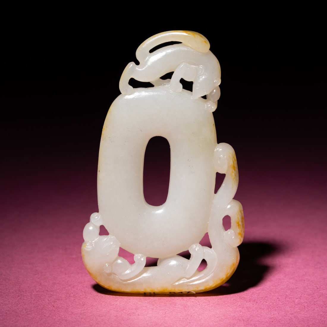 A Chinese Russet and White Jade 'Chilong' Pendant, 18th/19th Century: A Chinese Russet and White Jade 'Chilong' Pendant, 18th/19th Century 清中期 白玉留皮螭龍紋佩 18th/19th Century Centered with an oval b