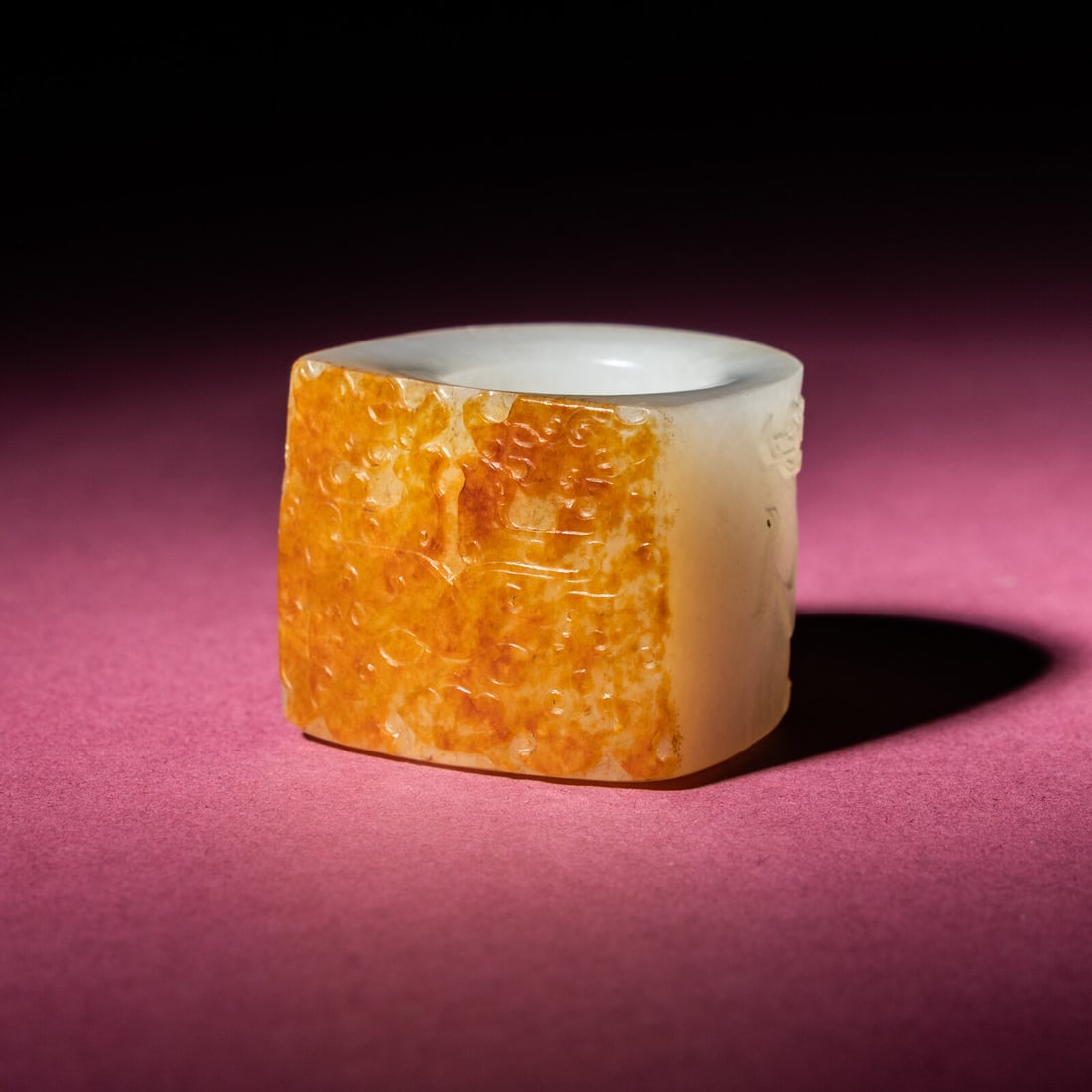 A Chinese Russet and White Jade 'Taotie and Chilong' Archer's Ring, 18th Century: A Chinese Russet and White Jade 'Taotie and Chilong' Archer's Ring, 18th Century 清中期 白玉留皮饕餮螭龍紋扳指 18th 