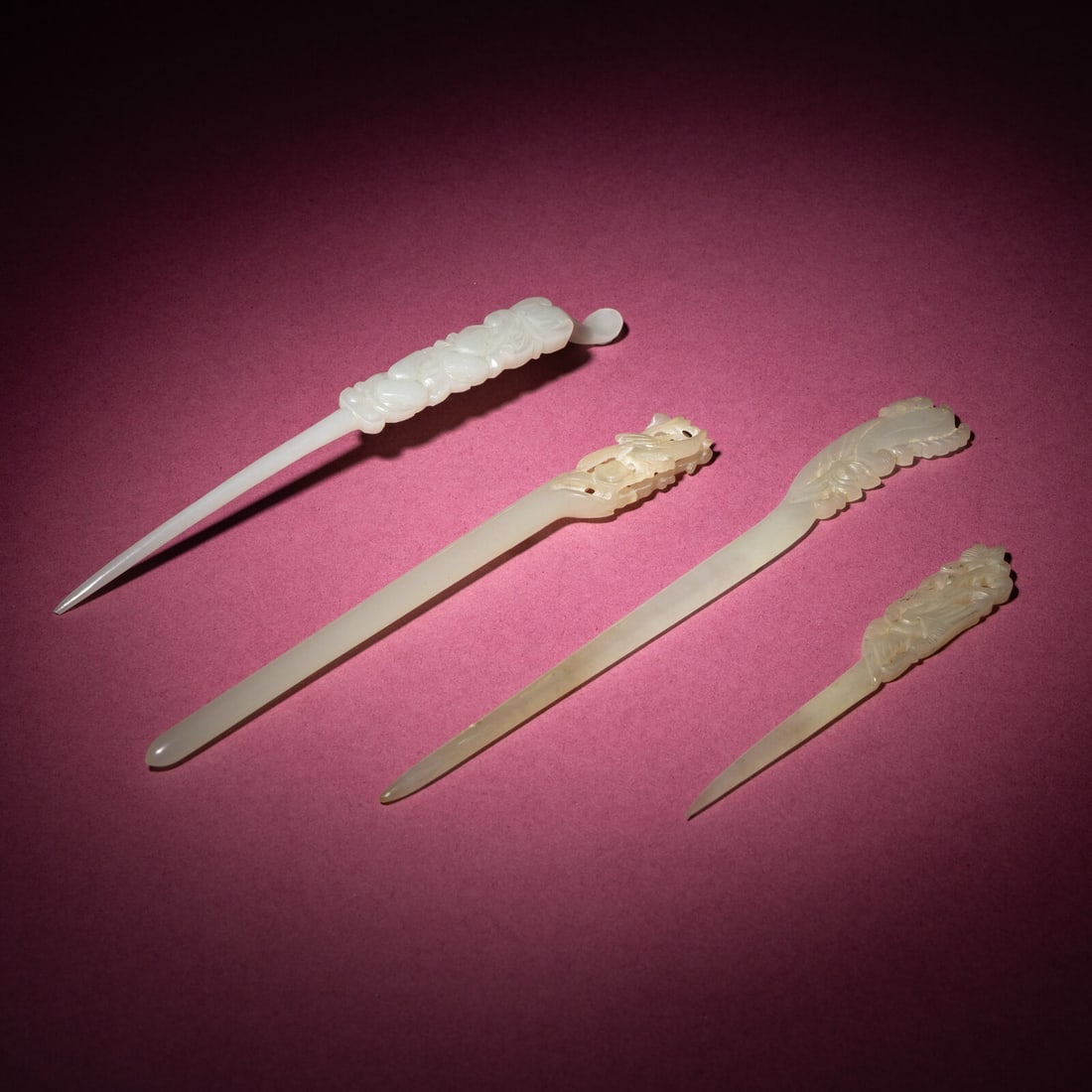 Four Chinese Carved Jade Hairpins, Qing Dynasty: Four Chinese Carved Jade Hairpins, Qing Dynasty 清 玉簪四支 Qing Dynasty (1644-1911) Each curved shaft surmounted by a top panel pierced and carved with floral and foliat