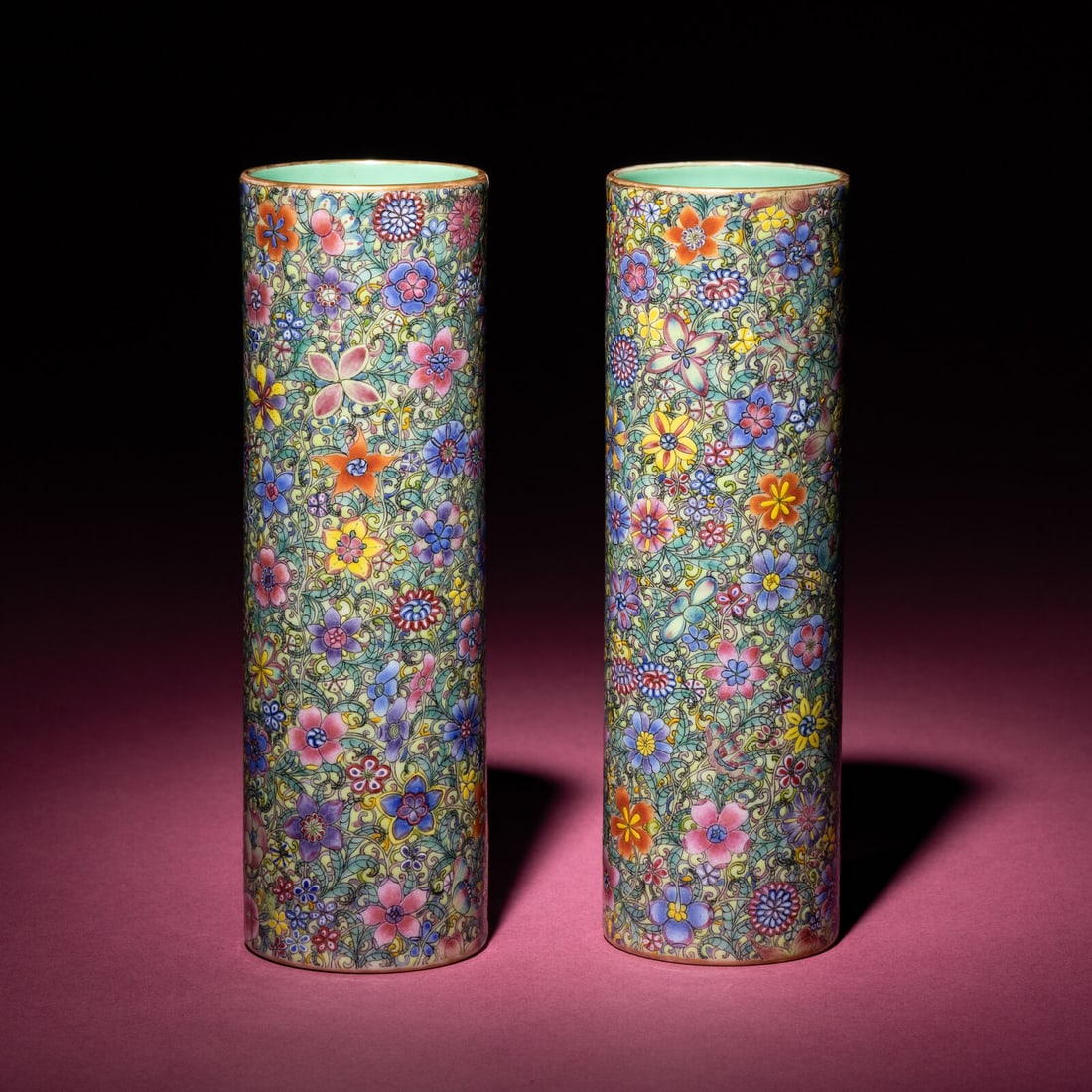 A Pair of Chinese Famille Rose 'Mille Fleur' Porcelain Brush Holders, Early 20th Century: A Pair of Chinese Famille Rose 'Mille Fleur' Porcelain Brush Holders, Early 20th Century 民國 粉彩百花不落地筆筒一對 Early