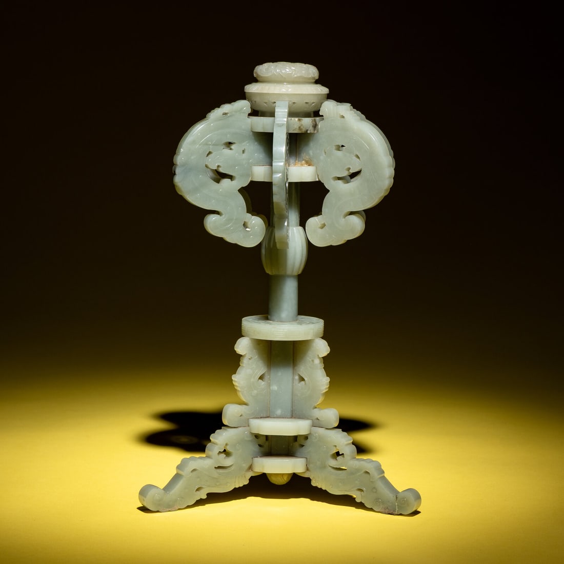 A Chinese Celadon Jade Hat Stand, 19th Century: A Chinese Celadon Jade Hat Stand, 19th Century 清晚期 青玉鏤雕夔龍紋冠架 19th Century Carved in multiple interlocking sections j