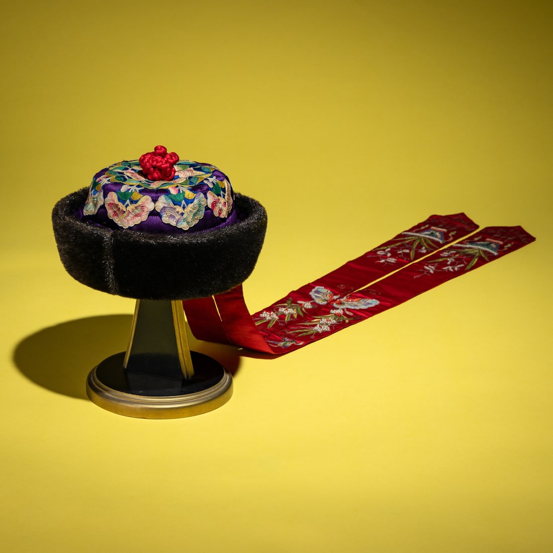 An Embroidered Silk Manchu Noblewoman's Winter Hat, Kunqiumao, 19th Century: An Embroidered Silk Manchu Noblewoman's Winter Hat, Kunqiumao, 19th Century 清晚期 紫頂蓋花鑲珠后妃坤秋帽 19th Centu
