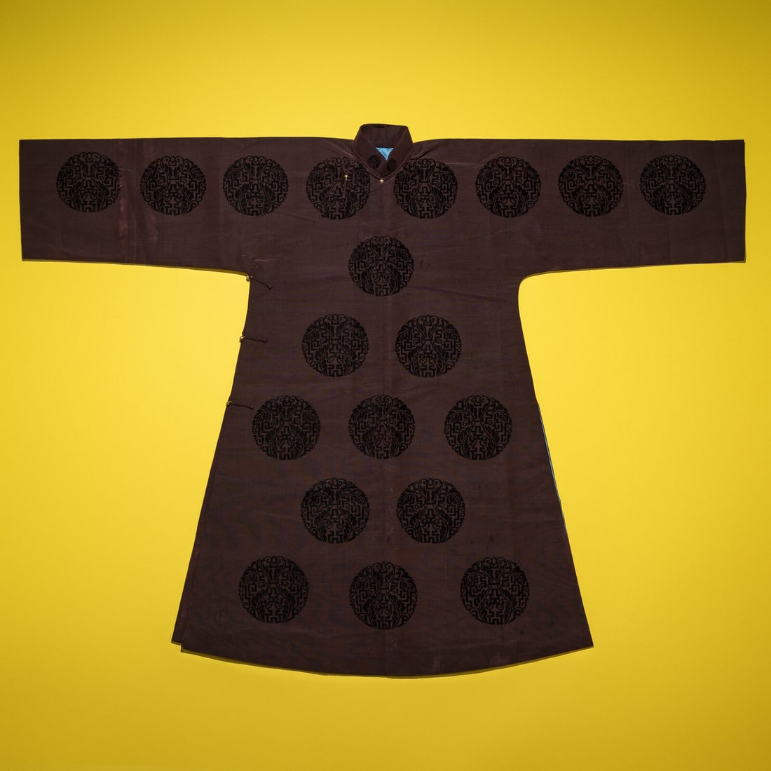 A Chinese Dark Brown Cut Velvet Robe, 20th Century: A Chinese Dark Brown Cut Velvet Robe, 20th Century 清晚期 醬地漳絨團壽紋袍 20th Century Woven with cut velvet medallions enclosing fol