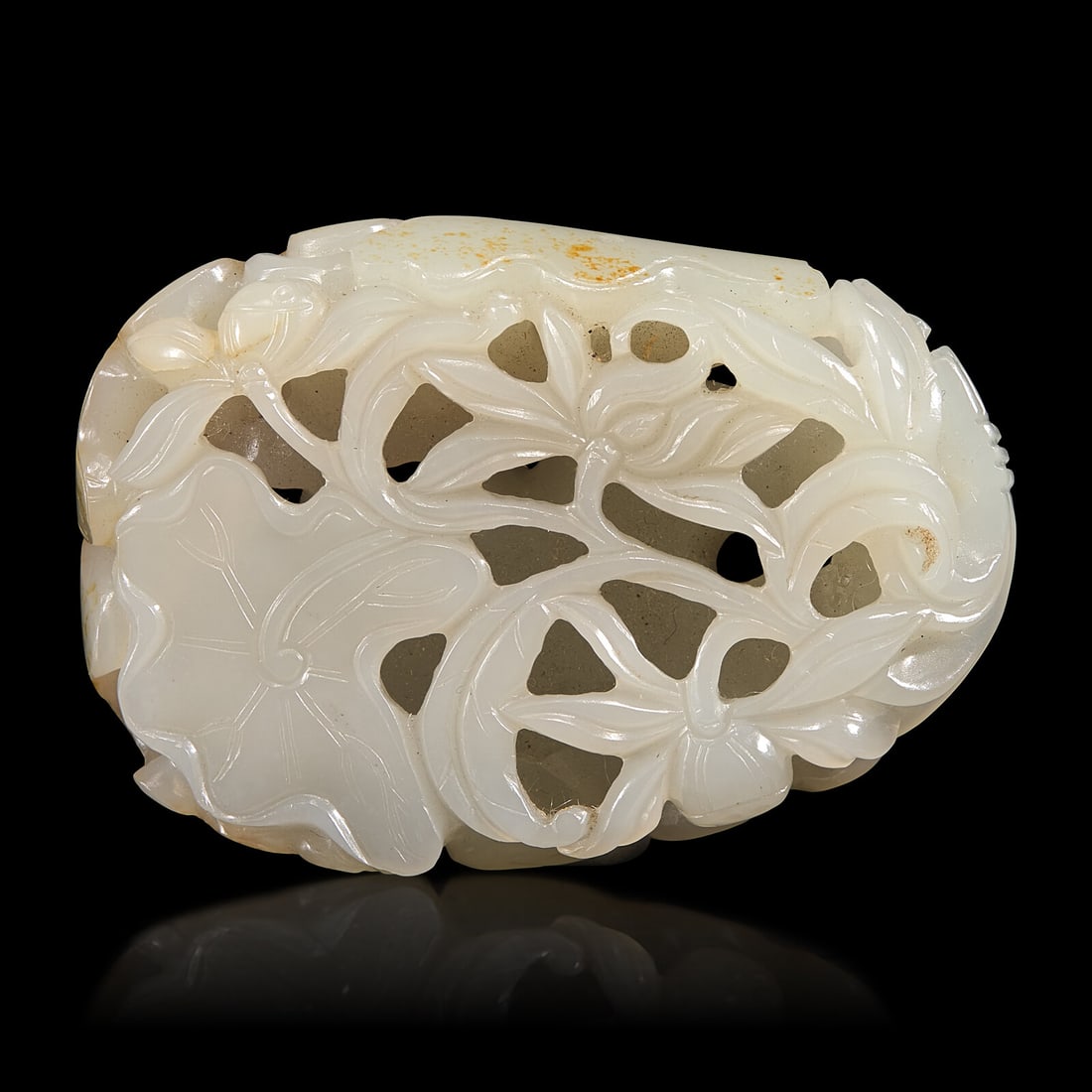 A Chinese White and Russet Jade 'Lotus' Pendant, 18th/19th Century (1 of 4)