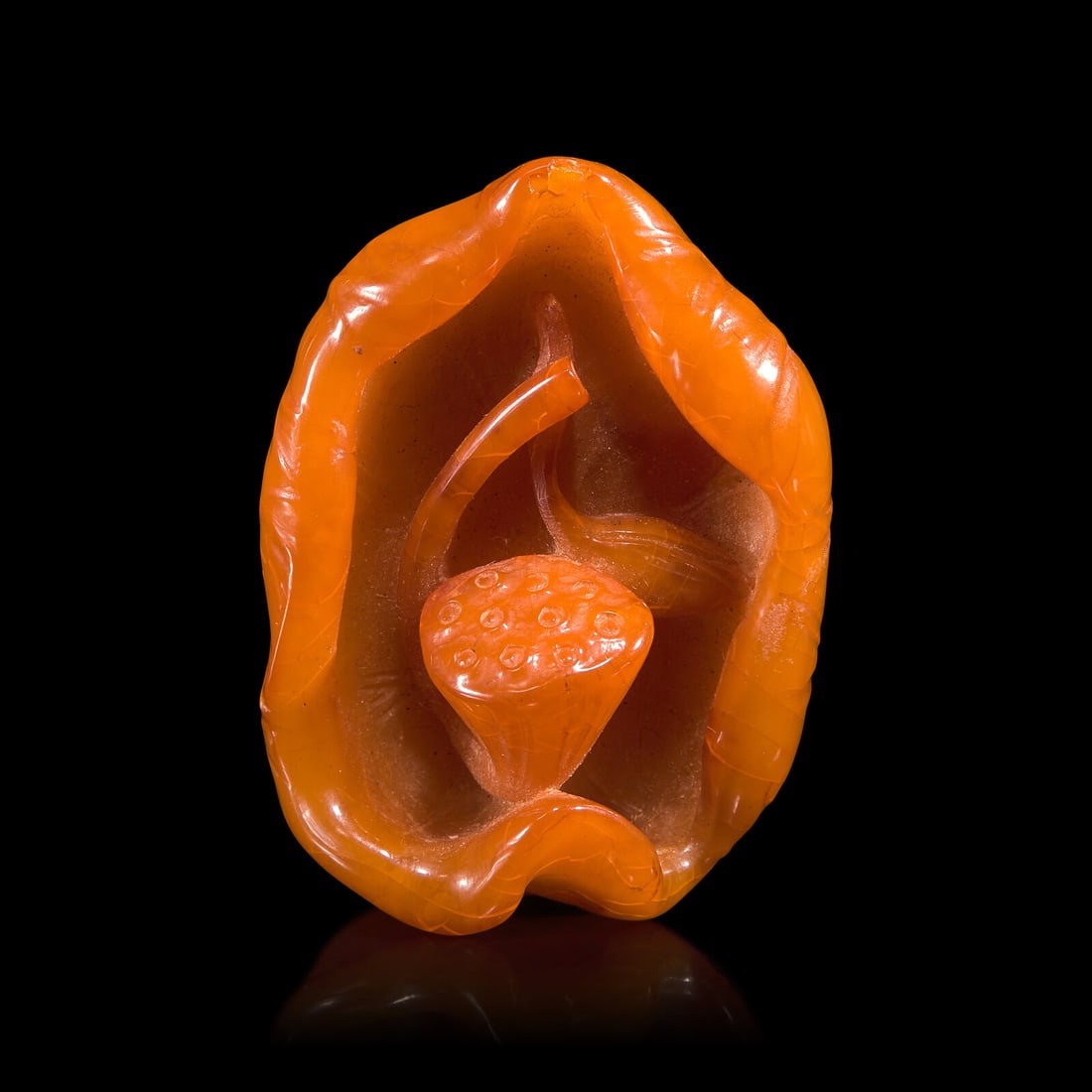 A Chinese 'Beeswax' Amber Lotus Pod and Leaf Pendant (1 of 4)