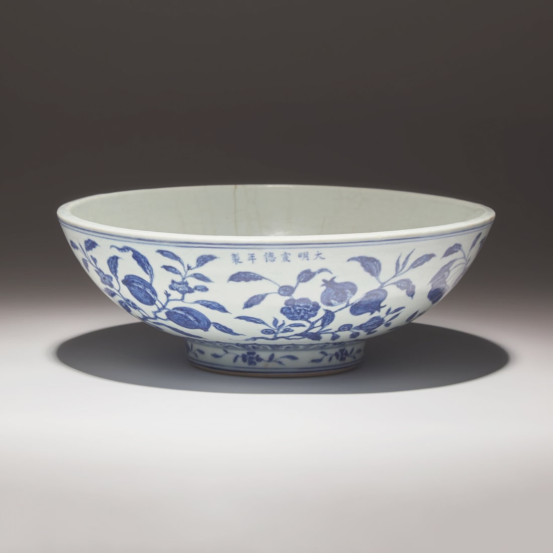 A Rare and Large Chinese Blue and White Porcelain 'Fruit and Flower' Bowl, Xuande Mark and Period: A Rare and Large Chinese Blue and White Porcelain 'Fruit and Flower' Bowl, Xuande Mark and Period 明宣德 青花折枝瑞果紋大骰é
