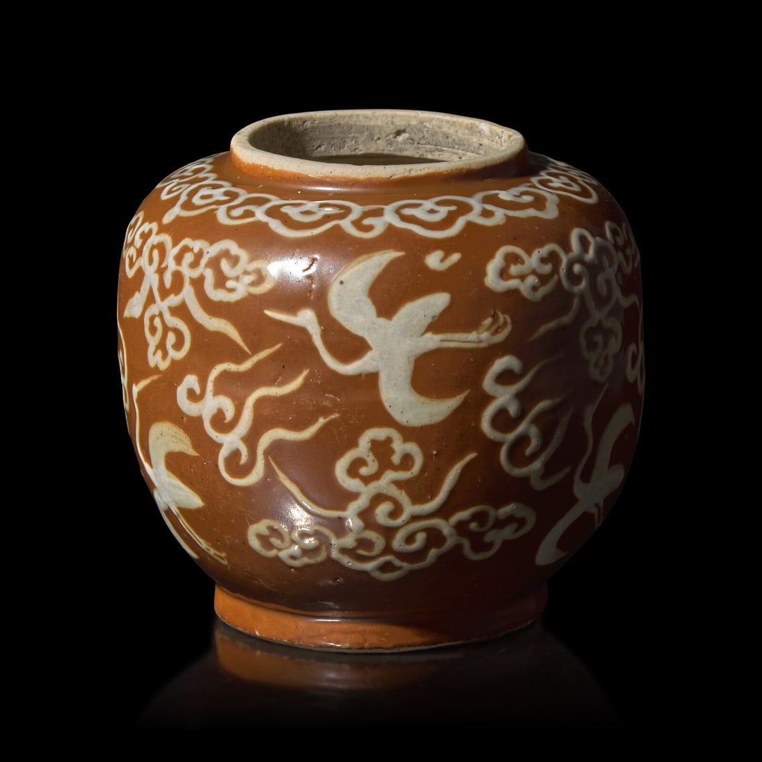 A Chinese White Slip Decorated Persimmon Ground Porcelain Jar, Ming Dynasty, Jiajing/Wanli Period (1 of 2)