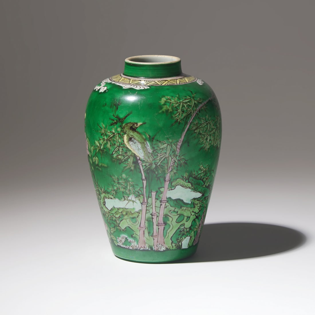 A Chinese Green Ground 'Birds and Bamboo' Porcelain Jar, Kangxi Period: A Chinese Green Ground 'Birds and Bamboo' Porcelain Jar, Kangxi Period 清康熙 綠彩繪花鳥竹石罐 Kangxi Period (1662-1722) Gracefully de