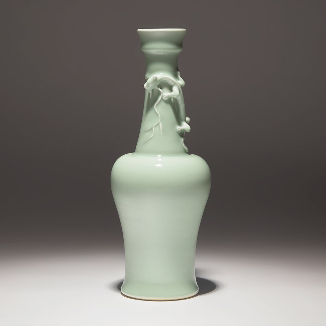 A Chinese Celadon Glazed 'Chilong' Vase, Yongzheng Mark: A Chinese Celadon Glazed 'Chilong' Vase, Yongzheng Mark 雍正款 粉青釉盤螭龍長頸瓶 Finely covered in a translucent celadon glaze,