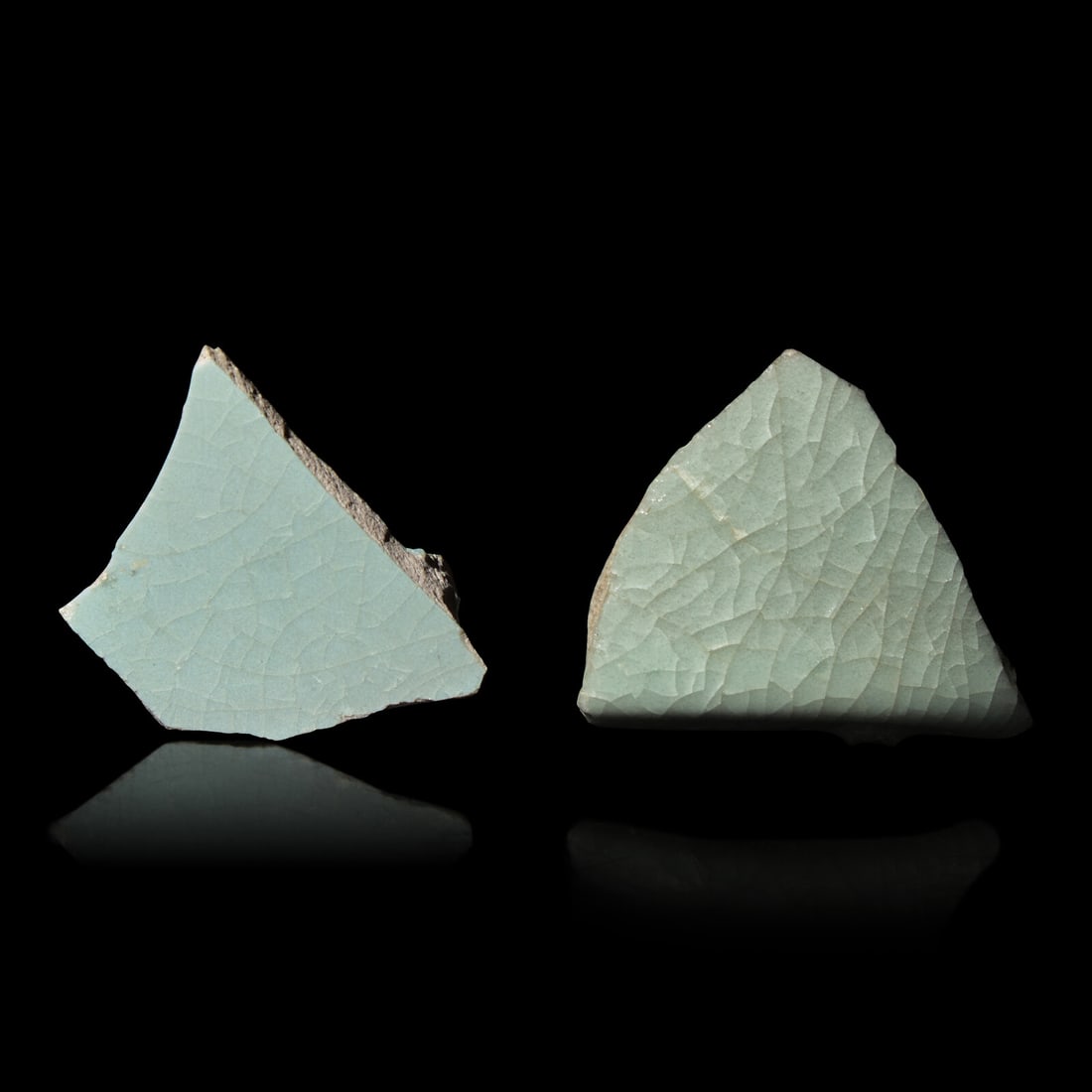 Two Chinese Celadon Glazed Ceramic Fragments, Song Dynasty: Two Chinese Celadon Glazed Ceramic Fragments, Song Dynasty 宋 汝窯及官窯帶支釘瓷片兩枚 Song Dynasty (960-1279) The group c