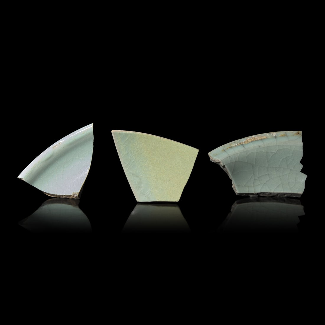 Three Chinese Celadon Glazed Fragments, Song Dynasty: Three Chinese Celadon Glazed Fragments, Song Dynasty 宋 汝窯、官窯及張公巷瓷片三件 Song Dynasty (960-1279) The group