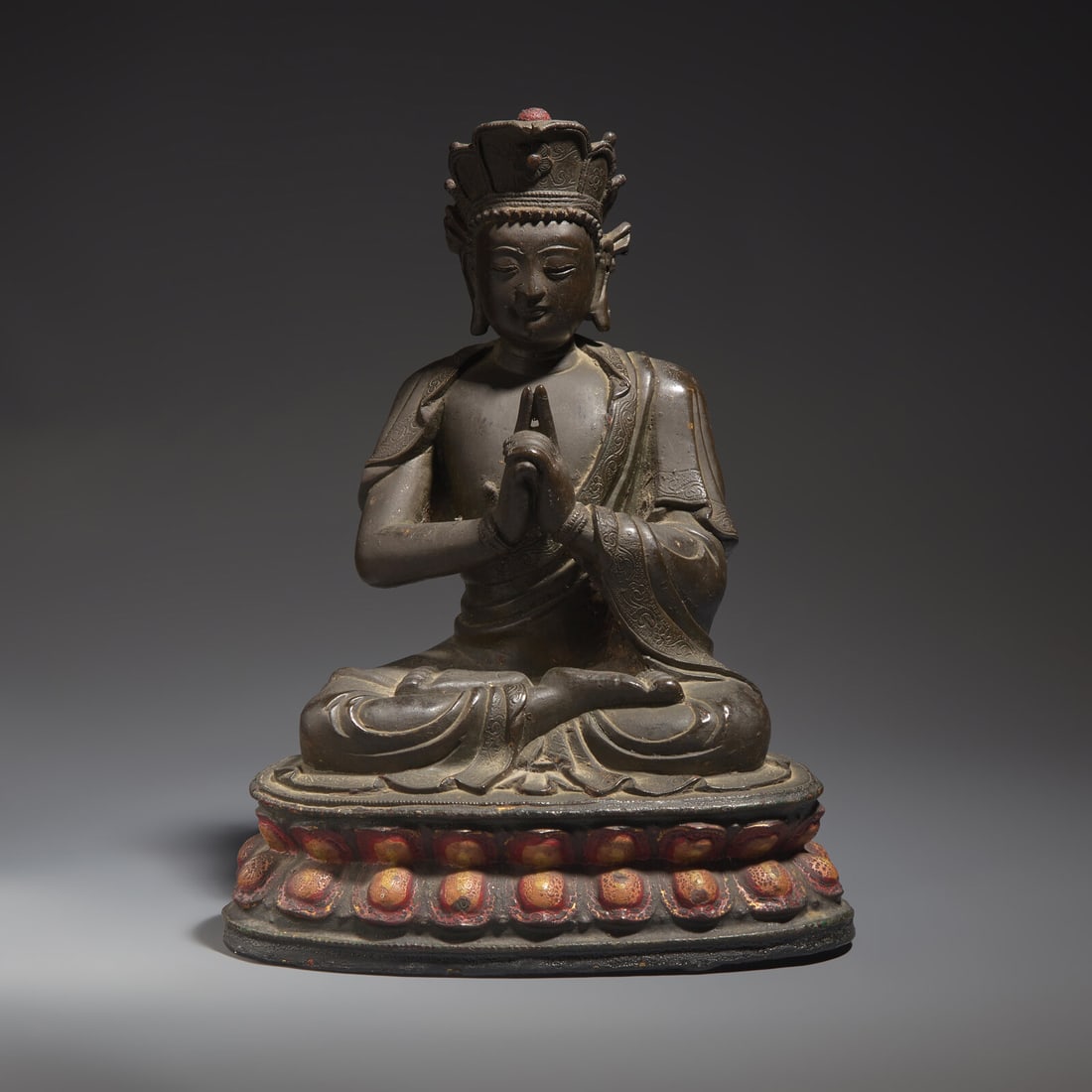 A Chinese Bronze Figure of a Seated Buddha, Ming Dynasty: A Chinese Bronze Figure of a Seated Buddha, Ming Dynasty 明 銅坐佛 Ming Dynasty (1368-1644) Seated in padmasana on a double-lotus base, clad in graceful draperies with scroll-i
