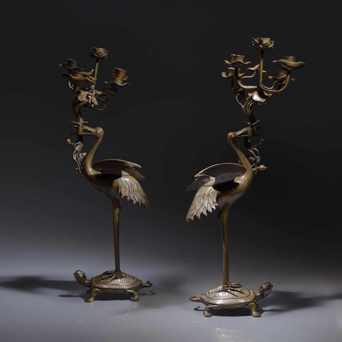 A Pair of Japanese Kaga Style Inlaid Bronze 'Crane and Minogame' Candelabra, Meiji Period: A Pair of Japanese Kaga Style Inlaid Bronze 'Crane and Minogame' Candelabra, Meiji Period 日本明治時期 銅龜鶴齊齡燭臺Ç