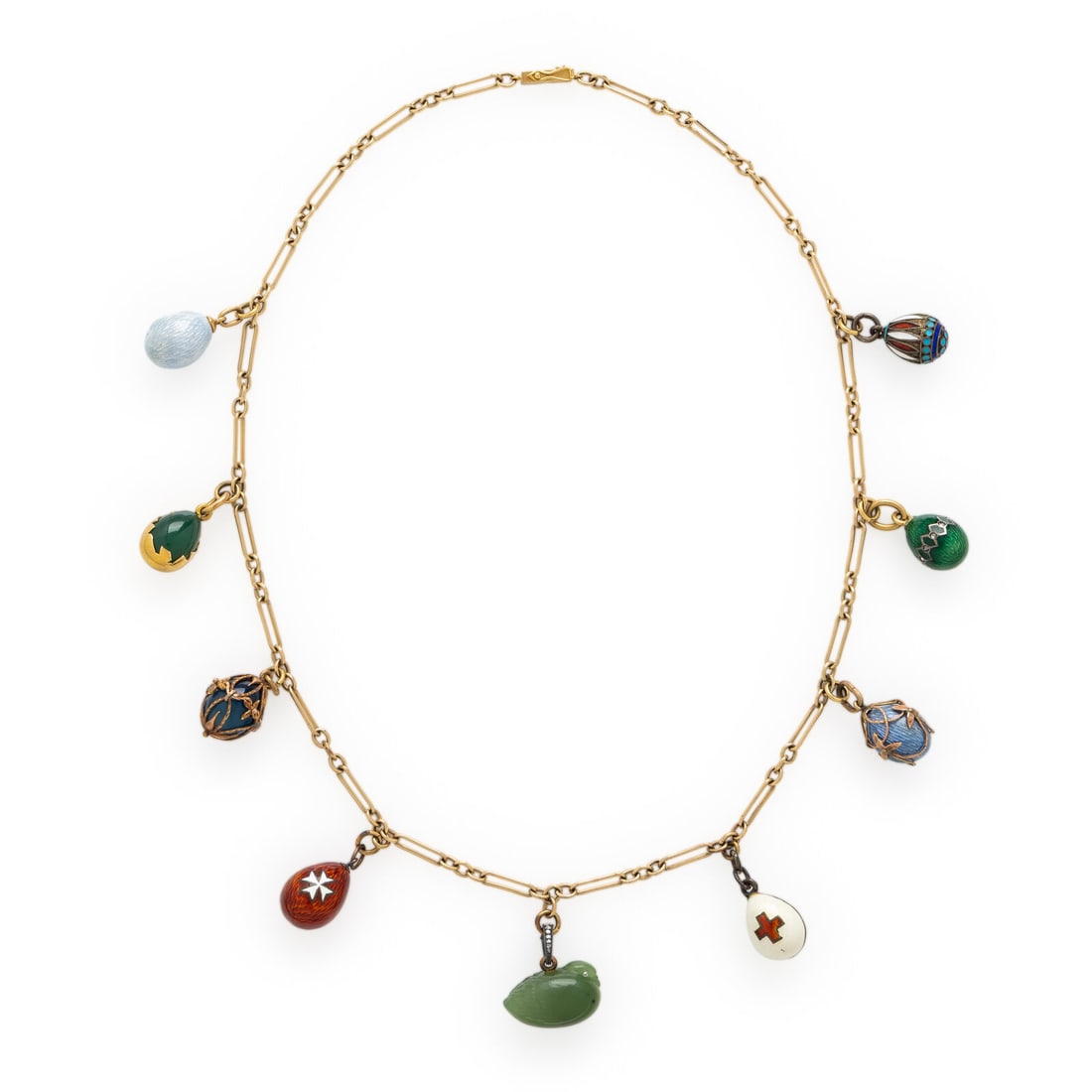 Russian, Attributed to Fabergé, Collection of Yellow Gold, Hardstone, and Enamel Charms: Russian, Attributed to Fabergé, Collection of Yellow Gold, Hardstone, and Enamel Charms Seven miniature Fabergé Easter egg charms, including one signed by Julius Rappoport, with guilloché enamel, r
