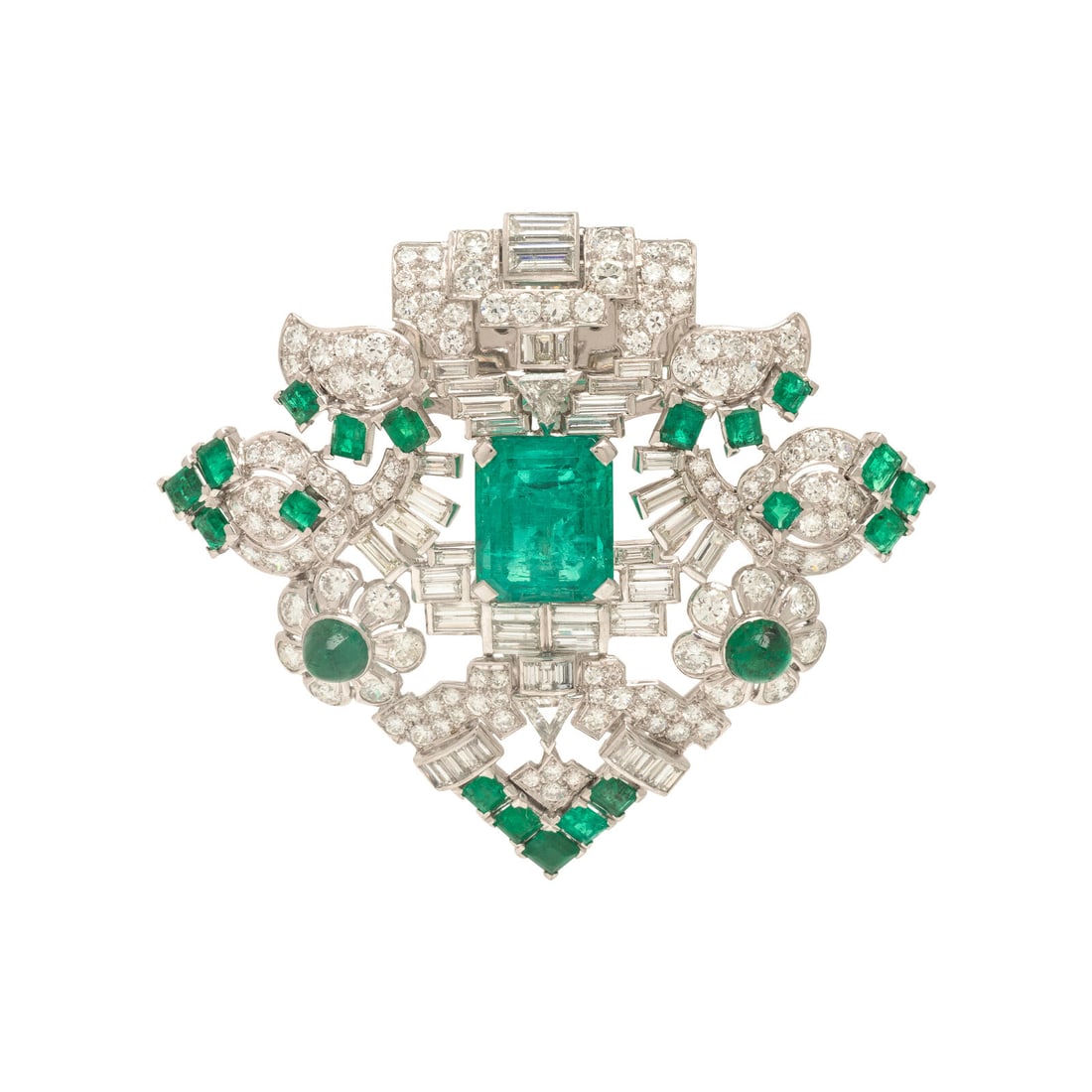 Seaman Schepps, Art Deco, Emerald, Diamond, and Platinum Clip Brooch: Seaman Schepps, Art Deco, Emerald, Diamond, and Platinum Clip Brooch Featuring an emerald cut emerald weighing approximately 8.75 carats by formula, surrounded by emerald and cabochon cut emeralds, an