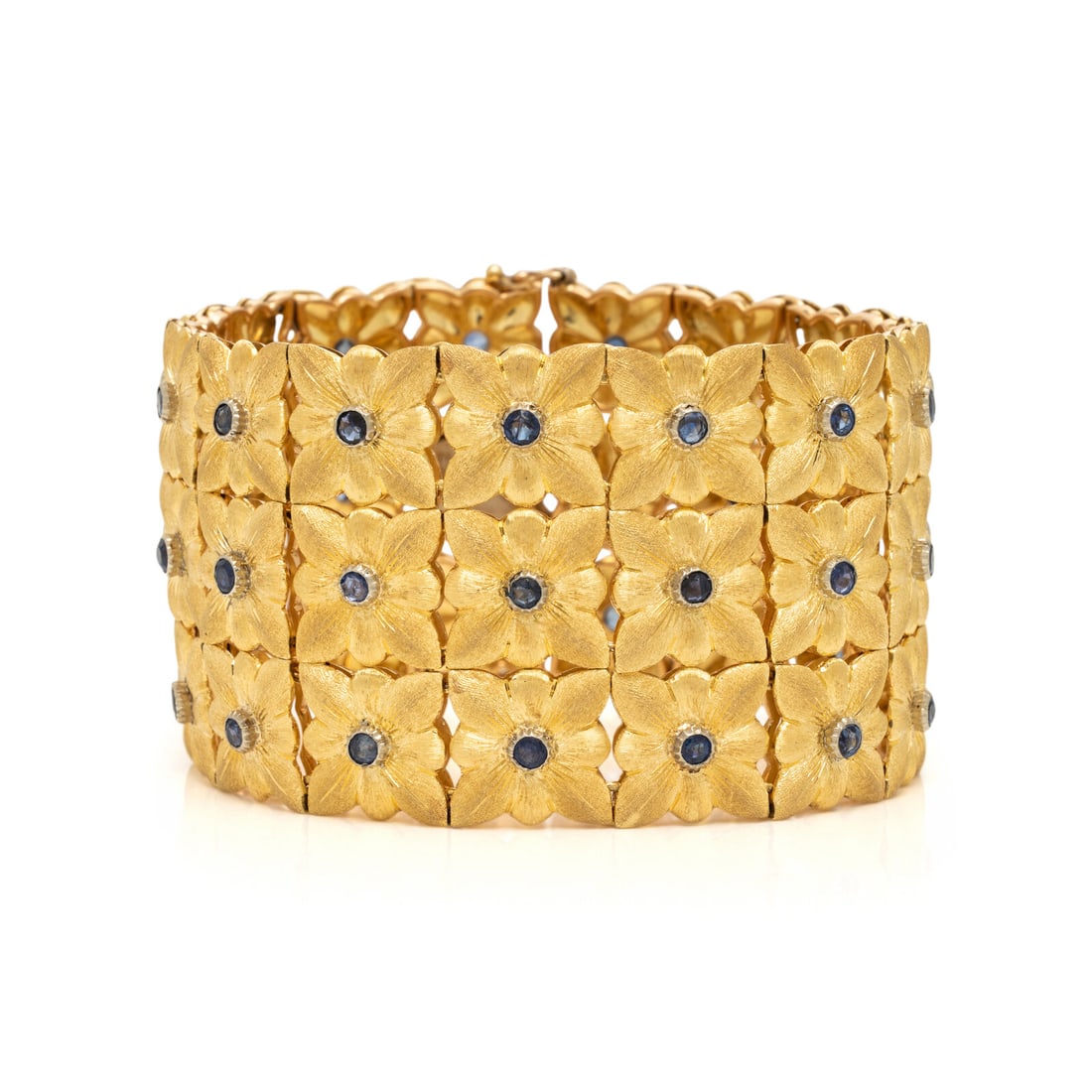 Buccellati, Sapphire and Yellow Gold Bracelet: Buccellati, Sapphire and Yellow Gold Bracelet Composed of engraved floral plaques, each set with a round sapphire. 18 karat yellow gold. 7 1/4 inches long, 1 1/2 inches wide. Engraved: BUCCELLATI ITAL
