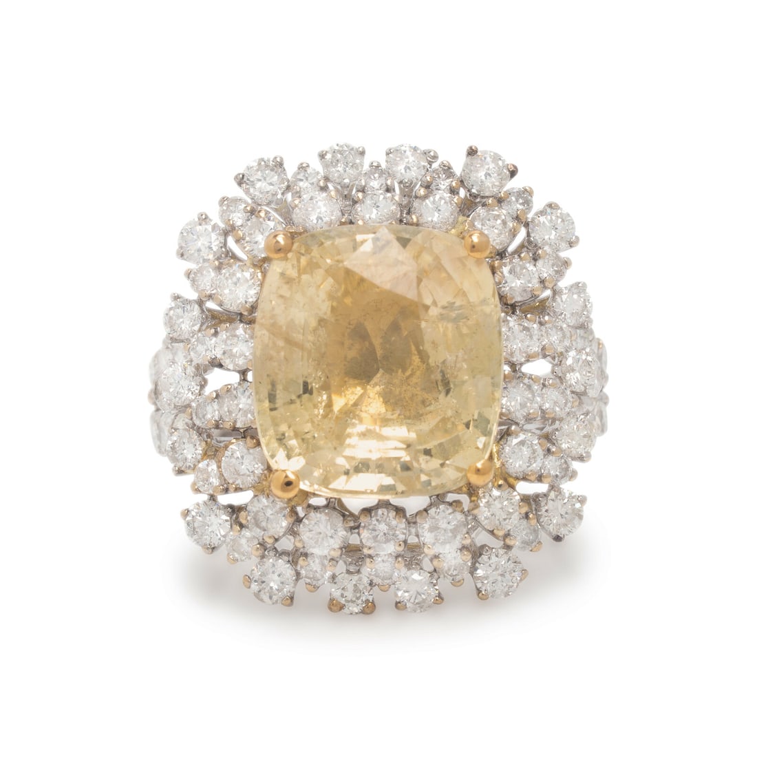 Yellow Sapphire and Diamond Ring: Yellow Sapphire and Diamond Ring Featuring a cushion cut yellow sapphire weighing approximately 8.80 carats, surrounded by round brilliant cut diamonds weighing approximately 1.80 carats total. Mounte