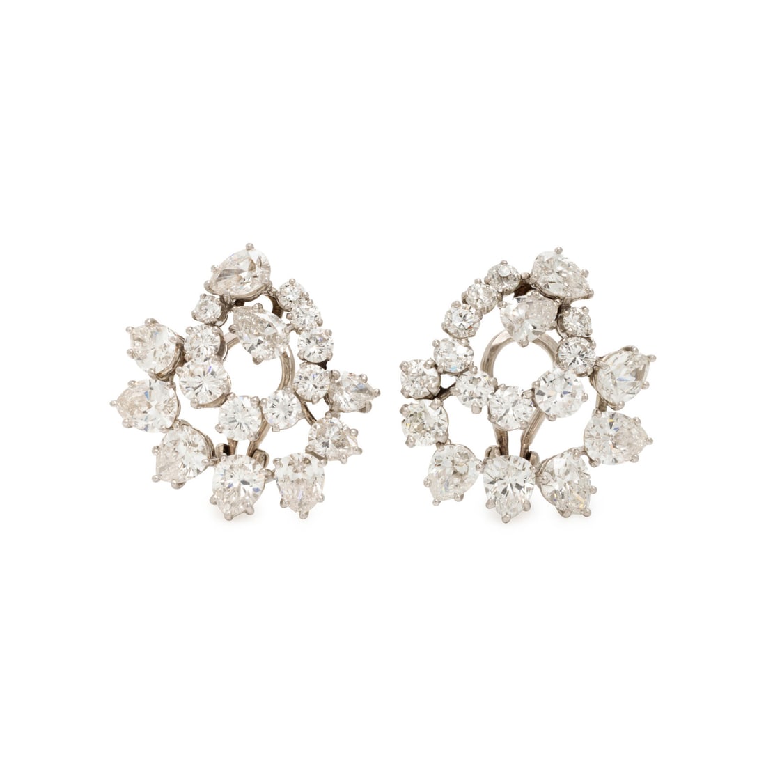 Diamond and Platinum Swirl Earrings: Diamond and Platinum Swirl Earrings Designed as swirls of pear shape, old European, old mine, and transitional cut diamonds weighing approximately 8.70 carats total. Mounted in platinum. 7/8 inch long