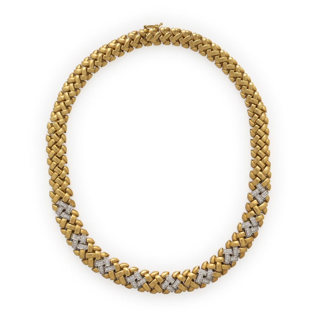 Yellow Gold and Diamond Necklace: Yellow Gold and Diamond Necklace In a brushed gold woven design, set with round brilliant cut diamonds weighing approximately 1.25 carats total. Mounted in 18 karat yellow and white gold. 16 1/2 inche
