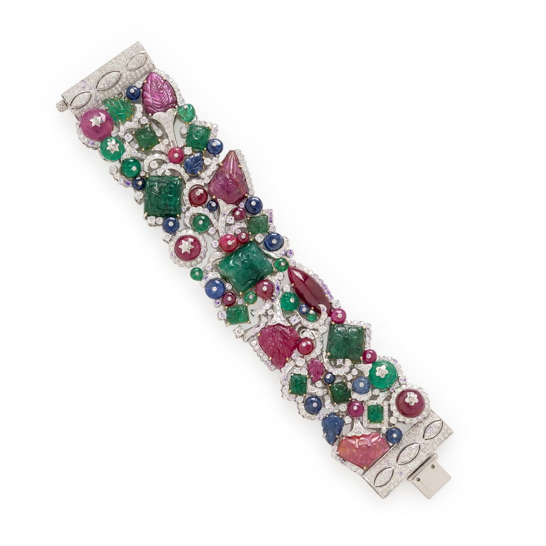 Ruby, Sapphire, Emerald, Diamond, and White Gold Bracelet: Ruby, Sapphire, Emerald, Diamond, and White Gold Bracelet Set with round brilliant cut diamonds weighing approximately 10.00 - 14.00 carats total, and carved rubies, sapphires, and emeralds. Mounted i