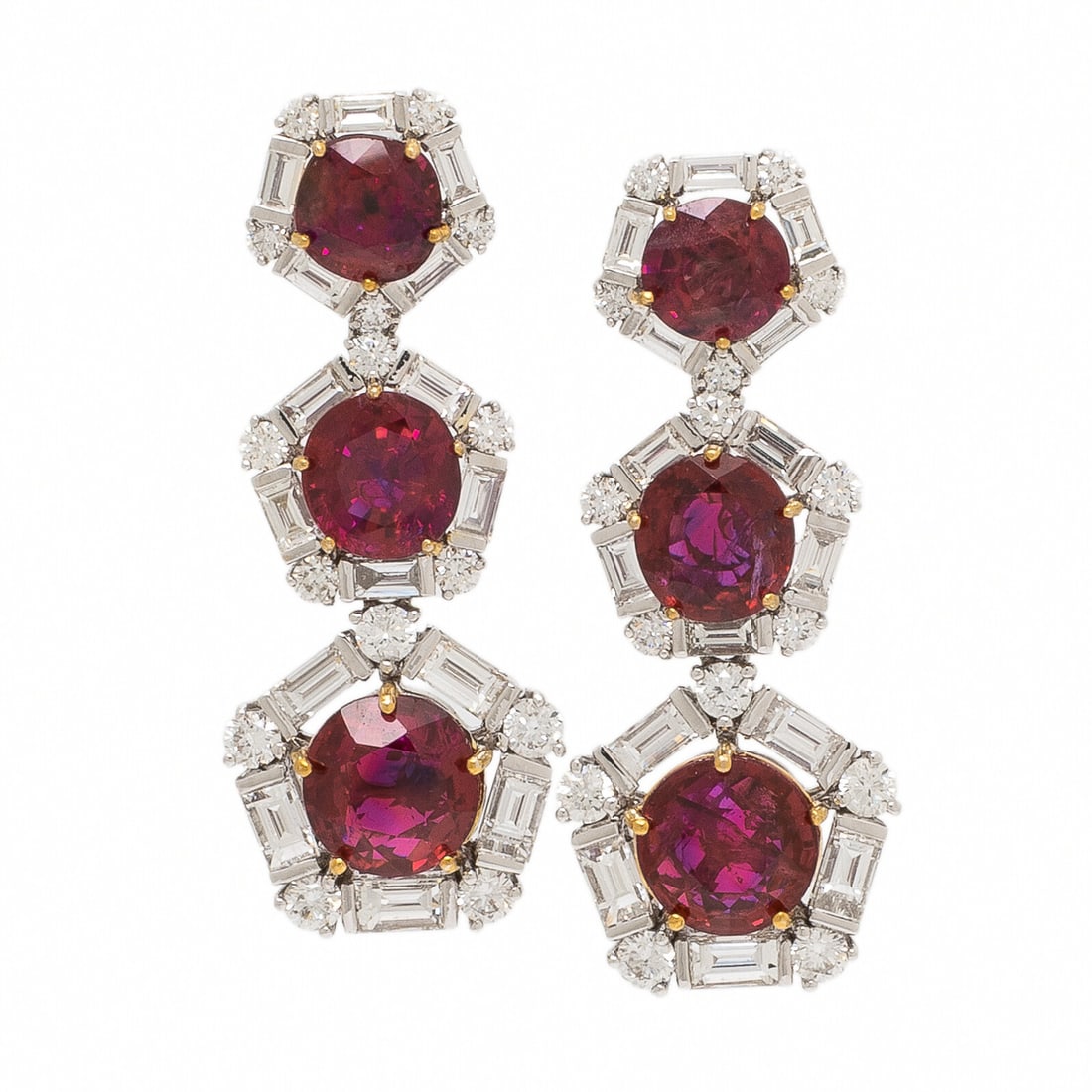 Burmese Ruby and Diamond Drop Earrings: Burmese Ruby and Diamond Drop Earrings Set with round Burmese rubies weighing approximately 4.90 carats total, each surrounded by round brilliant and baguette cut diamonds weighing approximately 1.55 