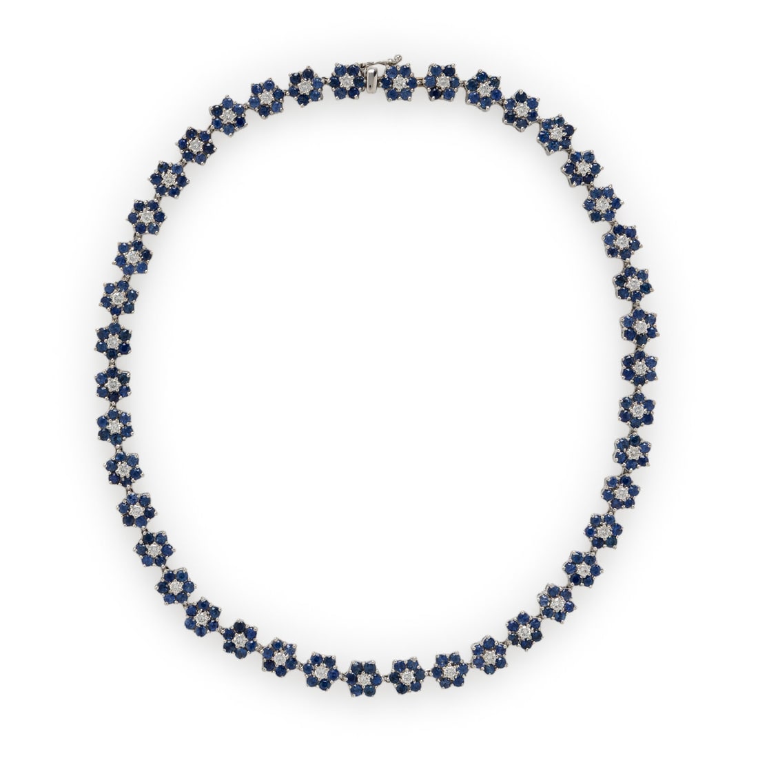 Diamond. Sapphire, and White Gold Flower Necklace: Diamond. Sapphire, and White Gold Flower Necklace Set with round sapphires, and round brilliant cut diamonds weighing approximately 3.30 carats total. Mounted in white gold. 15 3/4 inches long. Gross 