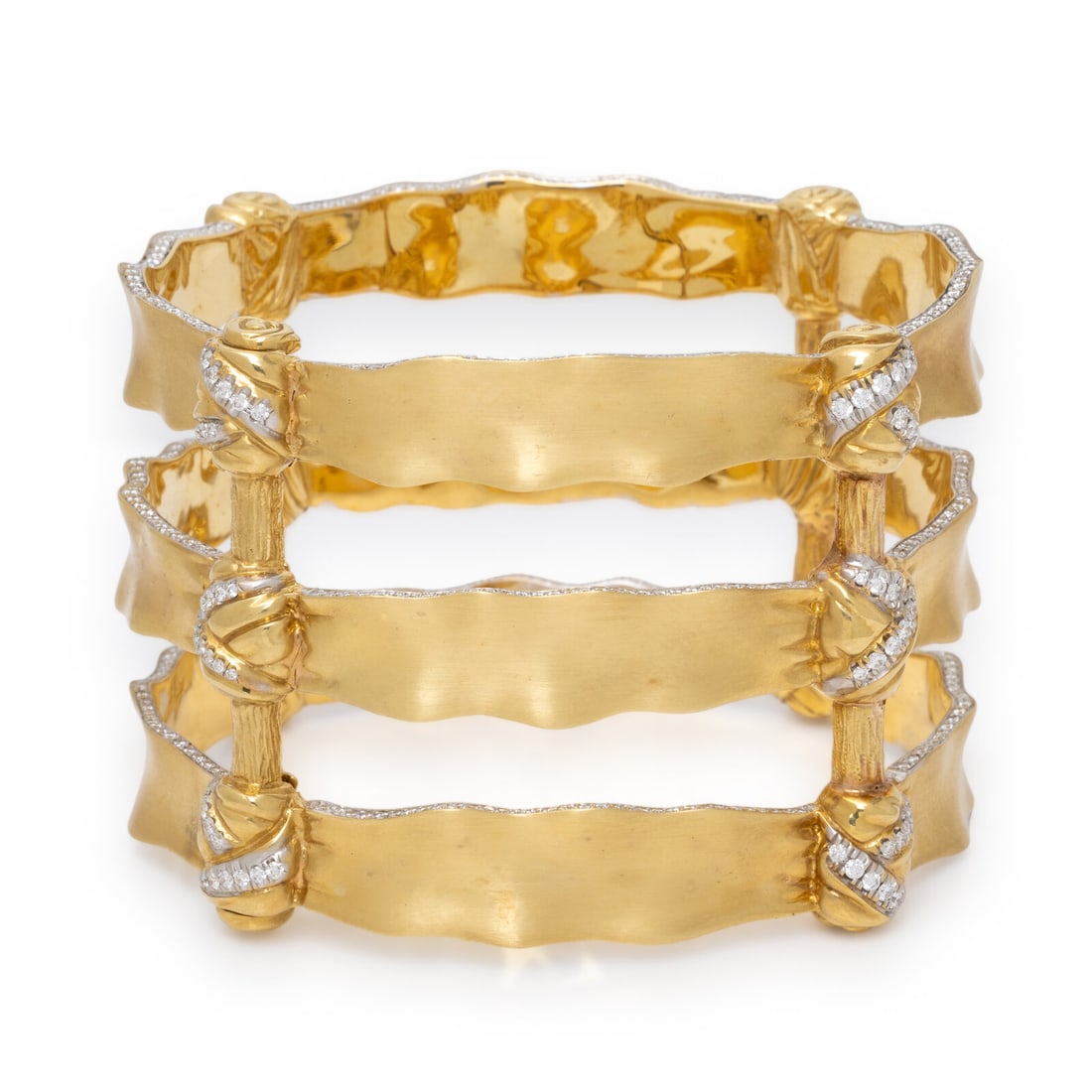 Mish, 'Bond Bow', Yellow Gold and Diamond Cuff Bracelet: Mish, 'Bond Bow', Yellow Gold and Diamond Cuff Bracelet Resembling three knotted ribbons, the sides of each element set with round brilliant cut diamonds weighing approximately 3.50 - 3.75 carats tota