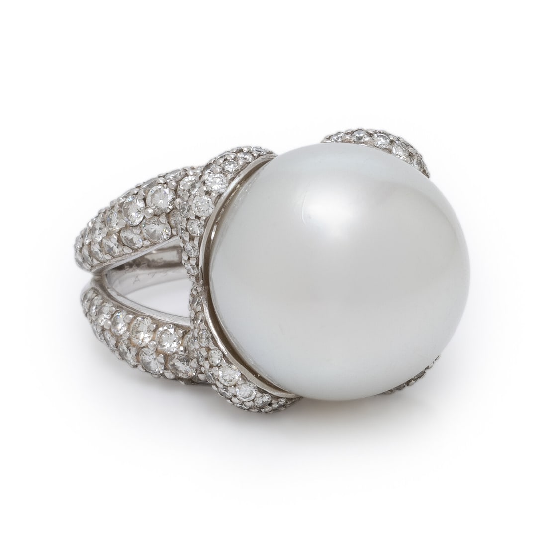 Mauboussin, Cultured Pearl, Diamond, and Platinum Ring: Mauboussin, Cultured Pearl, Diamond, and Platinum Ring Featuring a cultured pearl measuring approximately 17.00 mm, mounted in a crossover-motif basket with a split shank pavé set with round brillian