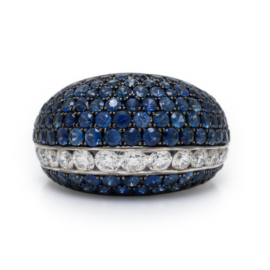 Sapphire, Diamond, and White Gold Ring: Sapphire, Diamond, and White Gold Ring Set with round brilliant cut diamonds weighing approximately 1.50 carats total and round sapphires. Mounted in 18 karat white and blackened gold. Ring size 6 1/4