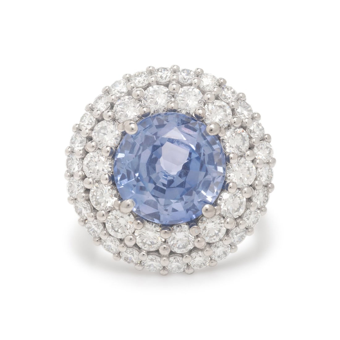 Ceylon Violet Sapphire, Diamond, and Platinum Ring: Ceylon Violet Sapphire, Diamond, and Platinum Ring Featuring a round Ceylon violet sapphire weighing approximately 6.31 carats, haloed by two rows of round brilliant cut diamonds weighing approximatel