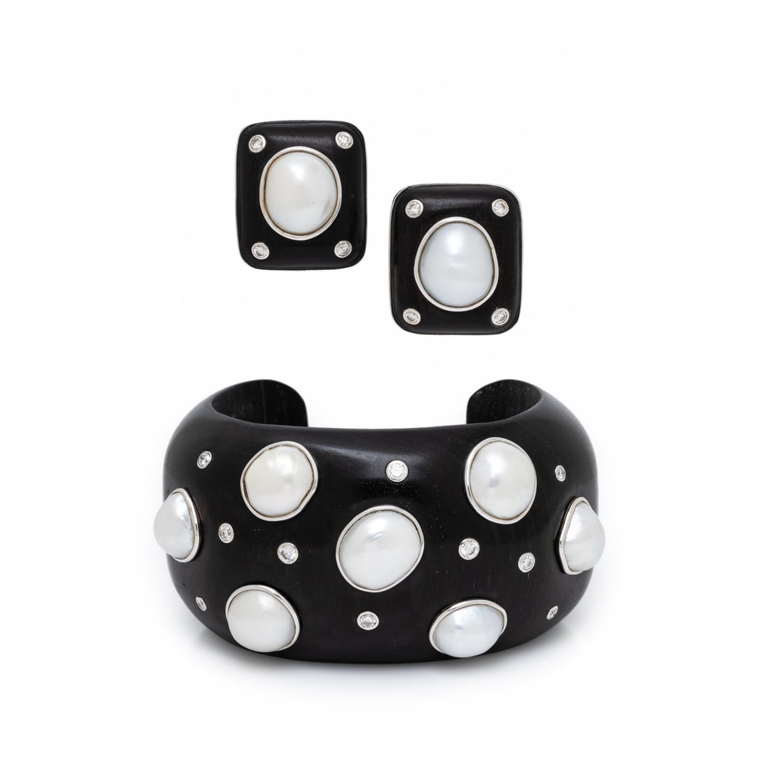 Trianon, Ebony, Diamond, and Cultured Pearl Cuff Bracelet and Earrings: Trianon, Ebony, Diamond, and Cultured Pearl Cuff Bracelet and Earrings Of carved ebony wood, the cuff bracelet with bezel-set round brilliant cut diamonds weighing approximately 0.65 carat total and