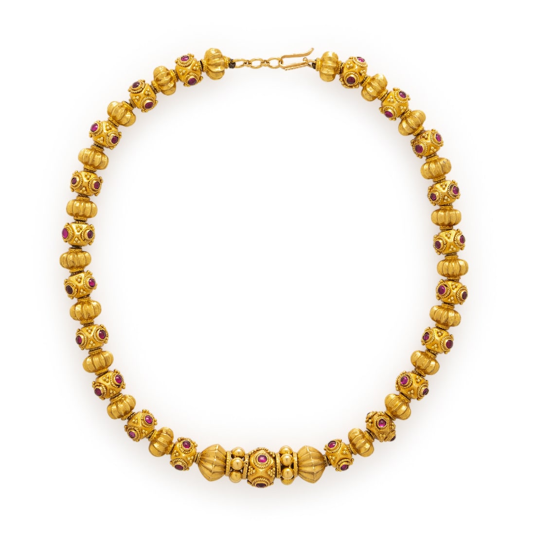 Yellow Gold and Synthetic Ruby Necklace: Yellow Gold and Synthetic Ruby Necklace Featuring hollow textured gold beads accented with applied wire twist and granulation, set with round cabochon synthetic rubies. Mounted in yellow gold. 16